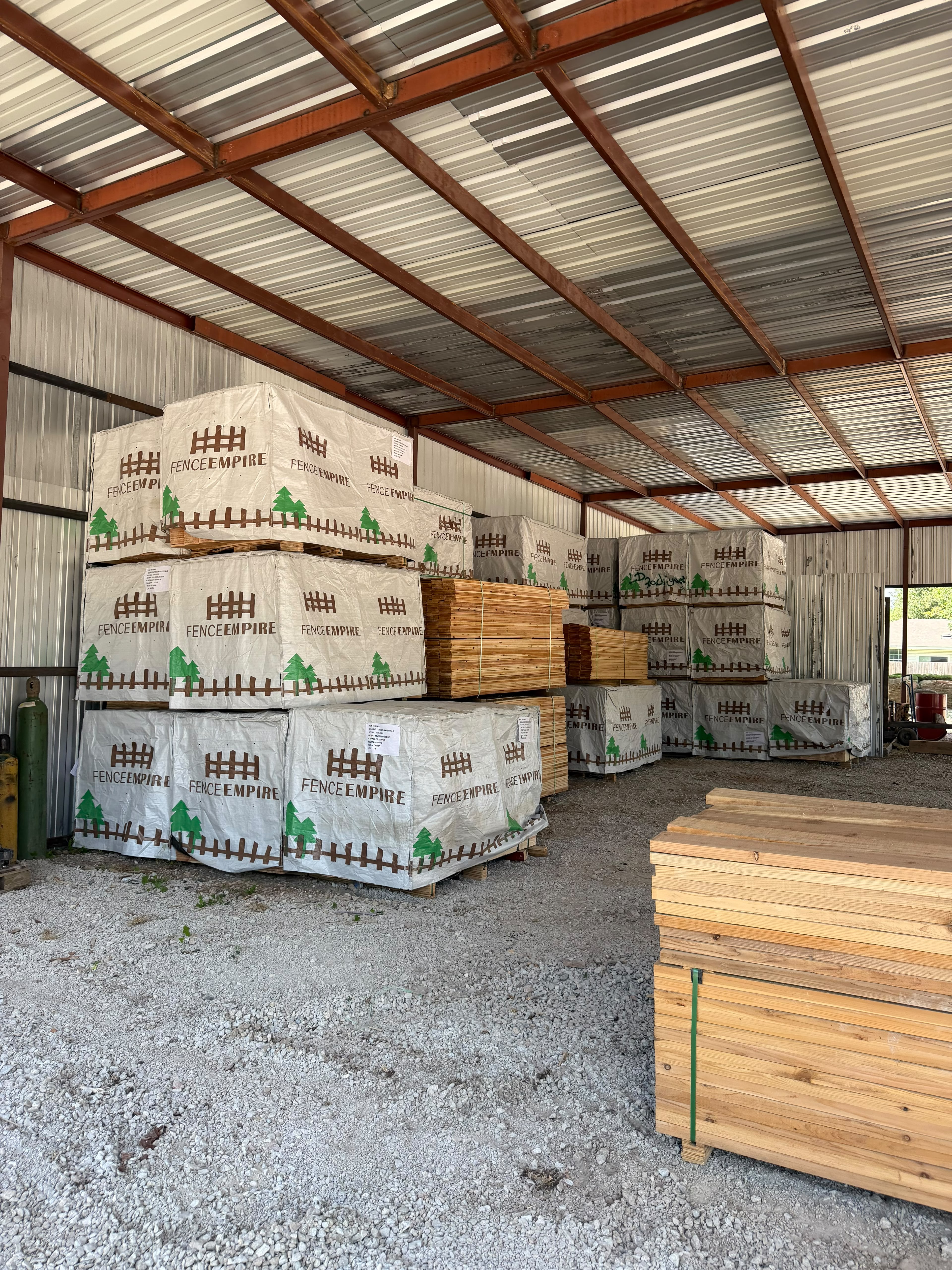 Fence Empire cedar picket pallets in covered yard