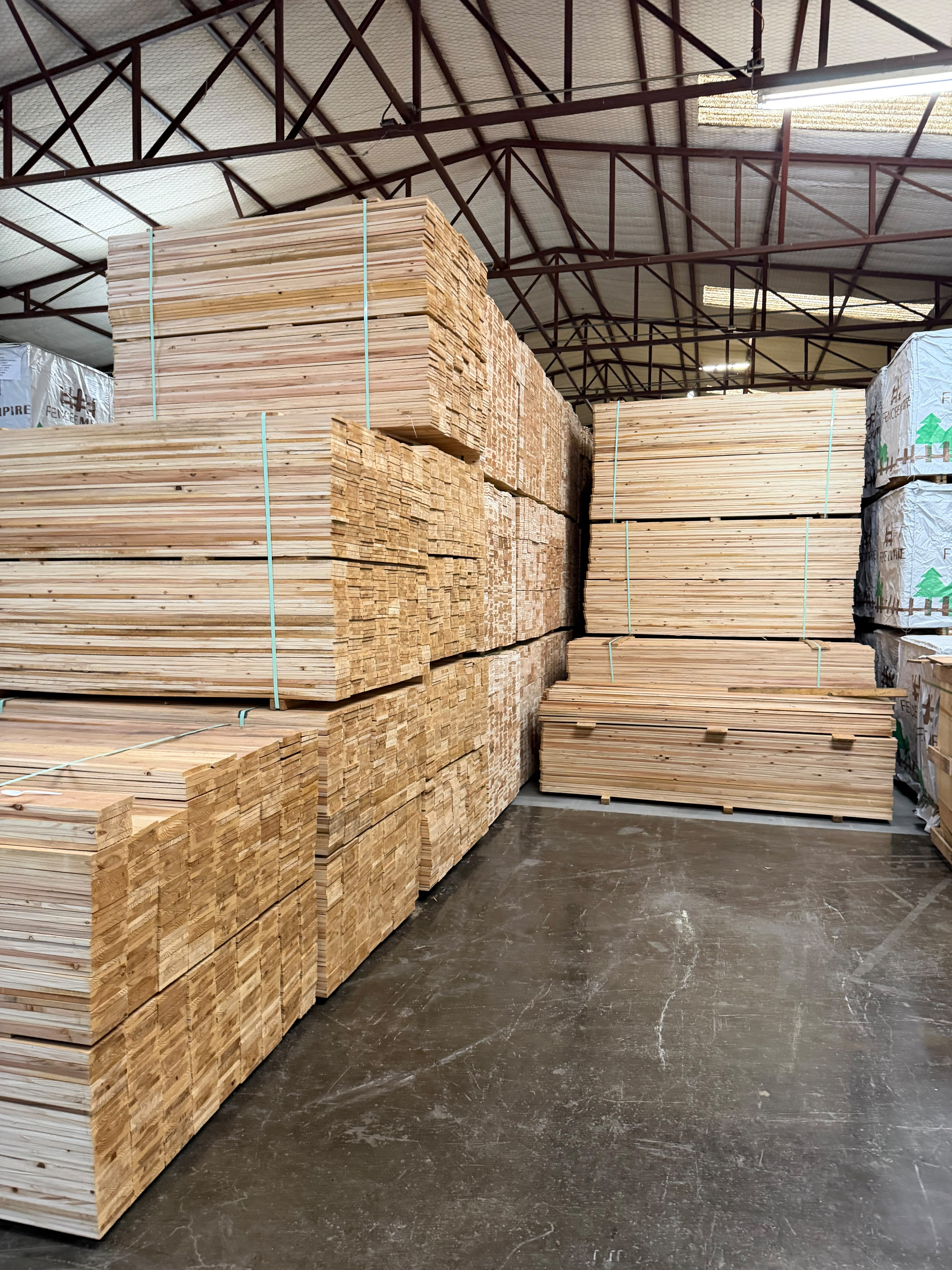 Cedar fence lumber bundles in warehouse